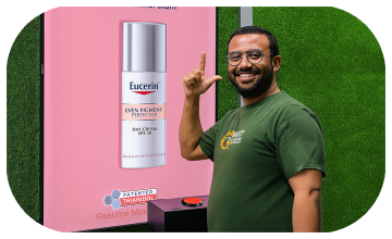 Guests playing Freeze the Frame interactive game at a corporate event in Dubai, focusing on screen visuals and pressing the button to stop the image at the perfect moment.